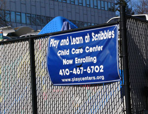 Play and Learn at Scribbles Child Care Center Sign